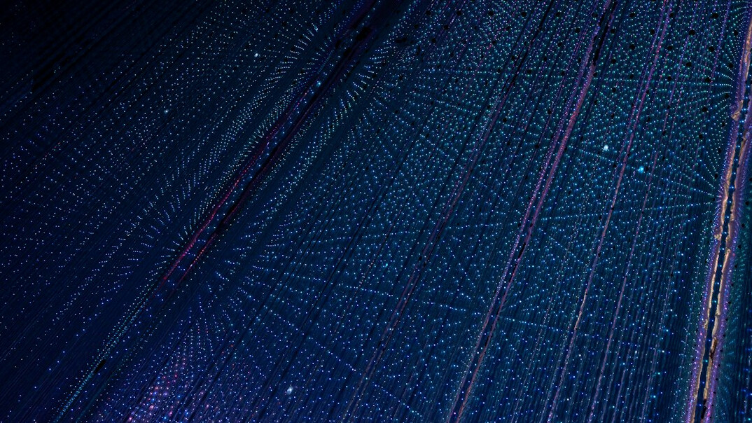 Close-up of electronic circuit board with glowing traces