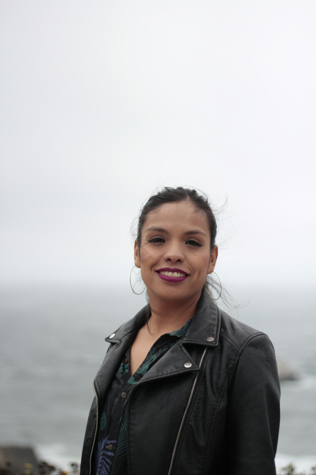 Portrait of a professional woman with dark hair smiling